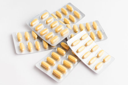 Close up of different medicine pills, tablets and vitamins isolated on white background, pharmaceutical picture taken with soft focusの写真素材