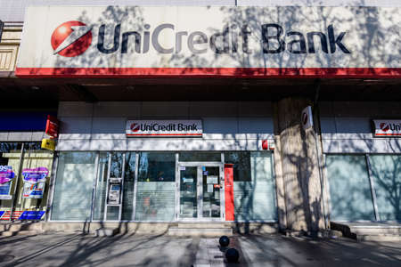 Bucharest, Romania - 22 November 2020: Main entry to a Unicredit Bank branch in a historical building in downtown in a sunny autumn dayのeditorial素材