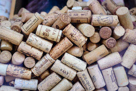 Bucharest, Romania, 27 March 2021: Bowl full of many used wine corks from a variety of wineriesのeditorial素材