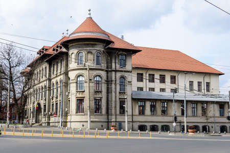 Bucharest, Romania, 20 March 2021: Main historical building of Gheorghe Sincai National College (Colegiul National Gheorghe Sincai) near Tineretului Park (Parcul Tineretului) in a sunny spring dayのeditorial素材