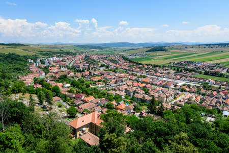 View from the stone walls at the Rupea Citadel (Cetatea Rupea) after renovation towards a small town in Brasov county, in the southern part of Transylvania (Transilvania) region, Romania in summerの写真素材