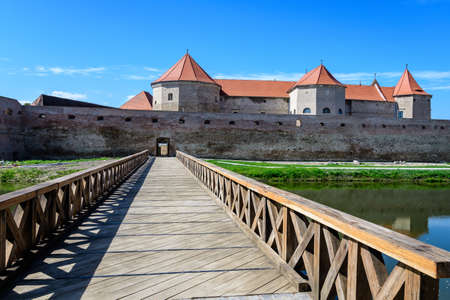 Large wooden bridge at the entry into the historical buildings of Fagaras Fortress (Cetatea Fagaras) in a sunny summer day, in Transylvania (Transilvania) region, Romaniaのeditorial素材