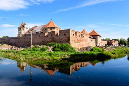 Renovated old historical buildings  of Fagaras Fortress (Cetatea Fagaras) during renovation works in a sunny summer day, in Transylvania (Transilvania) region, Romaniaのeditorial素材