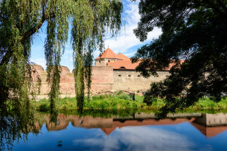 Renovated old historical buildings  of Fagaras Fortress (Cetatea Fagaras) during renovation works in a sunny summer day, in Transylvania (Transilvania) region, Romaniaのeditorial素材