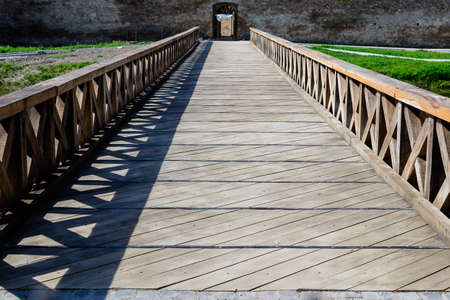 Large wooden bridge at the entry into the historical buildings of Fagaras Fortress (Cetatea Fagaras) in a sunny summer day, in Transylvania (Transilvania) region, Romaniaのeditorial素材