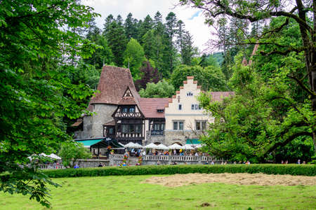 Sinaia, Romania - 3 July 2021: Old historical villa with restaurant near the Peles Castle, close to Bucegi Mountains (Muntii Bucegi) in Prahova Valley (Valea Prahovei) in a sunny summer dayのeditorial素材