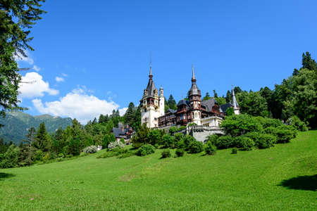 Beautiful neo-Renaissance building of Peles Castle (Castelul Peles) near Bucegi Mountains (Muntii Bucegi) in a sunny summer day in Sinaia town, Romaniaのeditorial素材