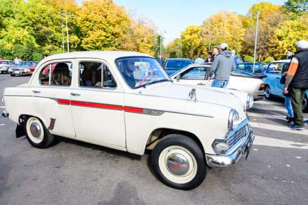 Bucharest, Romania, 24 October 2021: One vivid white Moskvitch 403 Russian vintage car in traffic in a street in the city center, in a sunny autumn dayのeditorial素材
