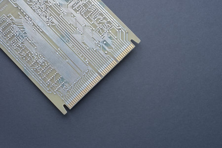 Close-up of a printed circuit board PCB with visible conductive tracks and connectors, illustrating electronic component layout and technology design.の写真素材