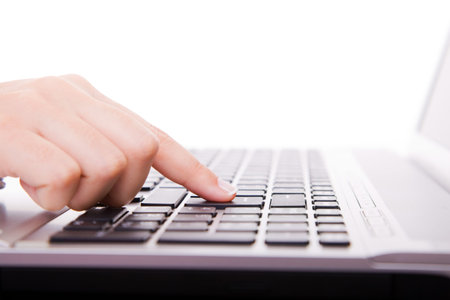 Close-up of secretary’s hand touching computer keys during work 