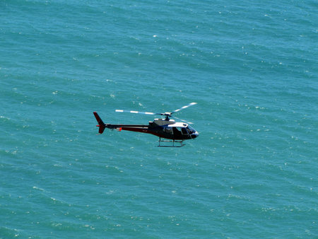 helicopter in blue skyの写真素材