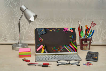 Children's desk prepared with the necessary for the return to schoolの写真素材