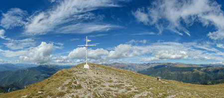 Giant cross that marks the top of the mountain in the Pyreneesの写真素材