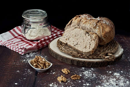 Rustic homemade round bread stuffed with walnuts and home baked in the traditional styleの写真素材