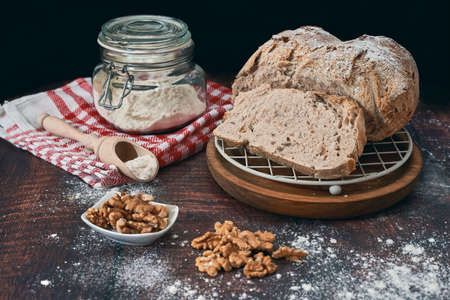 Rustic homemade round bread stuffed with walnuts and home baked in the traditional styleの写真素材