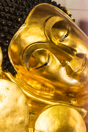 reclining buddha image in thailandの写真素材