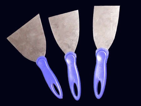Spatulas in black backgroundの写真素材