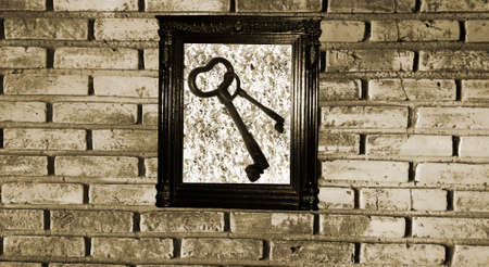 Old frame with keys on the wallの写真素材