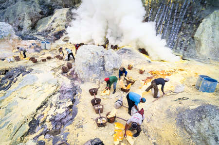 Workers at Ijen volcano in Java, Indonesia collecting sulphurのeditorial素材