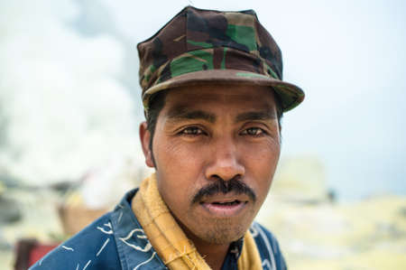 Portrait of a man working at the sulfur mine of Ijen in East-java, Indonesiaのeditorial素材