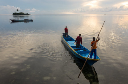 Banda Islands, Indonesia - February 2, 2013: Early morning boat yearlings Hatta island.