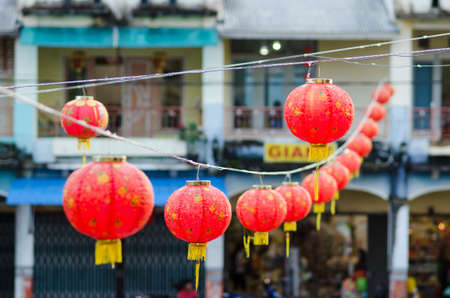 Red Chinese lantern hanging in a street for Chinese New Year.の写真素材