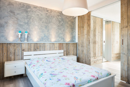 Modern bright bedroom whit a loot of woodの写真素材
