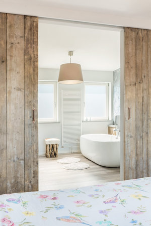 Modern bright bathroom and bathroom with seperate bathの写真素材