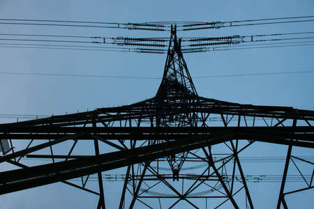 Electricity pylon viewed from below looking towards the skyの写真素材