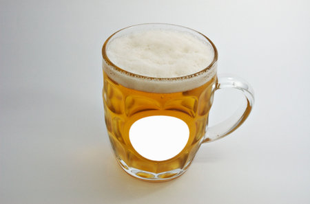 glass of beer on white with place for label