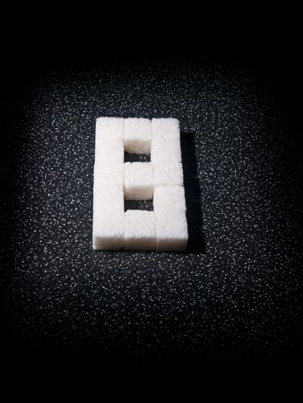 Digit eighth built from lumps sugar in dark toneの写真素材