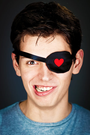 attractive young amorous pirate in the eye-bandの写真素材