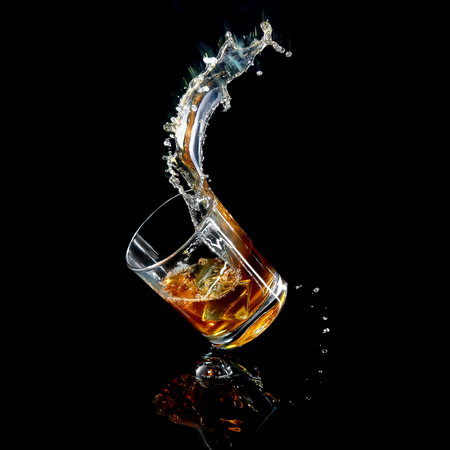 Splashing incline glassin process of fallingの写真素材