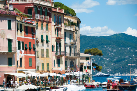 Portofino, Italy.  22 july, 2012. Colorful buildings, shops and restaurants along the harbor in a sunny day in summer.のeditorial素材