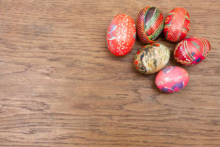 Easter eggs on an old wooden table - copy space.の写真素材