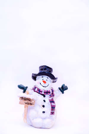 Little snowman welcomes winter.の写真素材