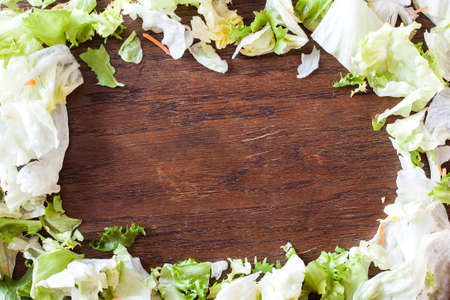 Healthy food abstract background - green vegetables, rustic wooden table.の写真素材
