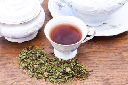 Elegant china with tea and tea leaves.の写真素材