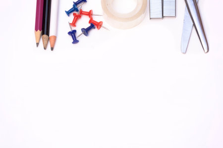 Scissors, tape, pencils and tacks with copy space.の写真素材