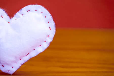 Valentine's Day - White heart on a pastel background.の写真素材