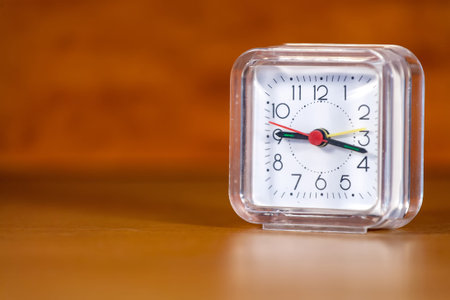 Vintage clock on a wooden table.