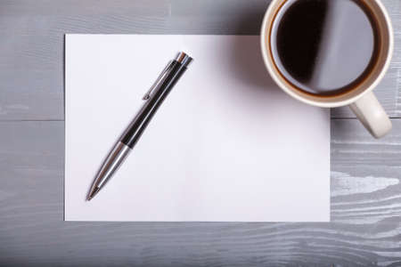Old vintage coffee pen sheet paper letter business grey wooden background flatlay top viewの写真素材