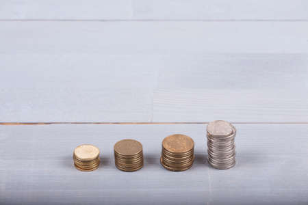Money change coins stacks natural grey light white wooden background business abstractの写真素材