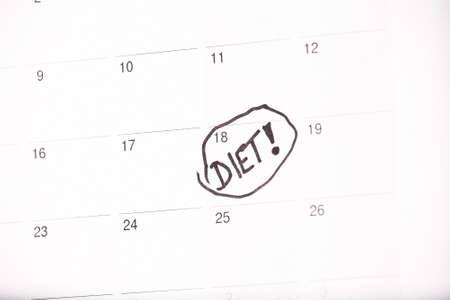 Diet start white calendar light natural wooden backgroundの写真素材