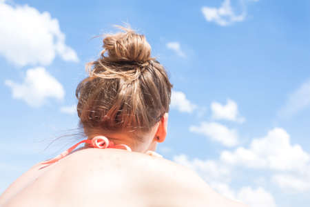 Young beautiful woman enjoying her summer vacation on a beach.の写真素材