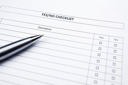 Checklist with a pen. Yes or no choice.の写真素材