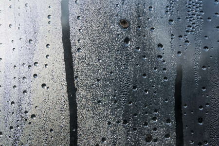 Droplets of water on a window as a background.の写真素材
