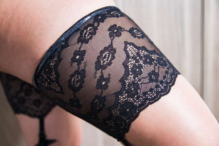 Young attractive woman legs in a sexy stockings.の写真素材