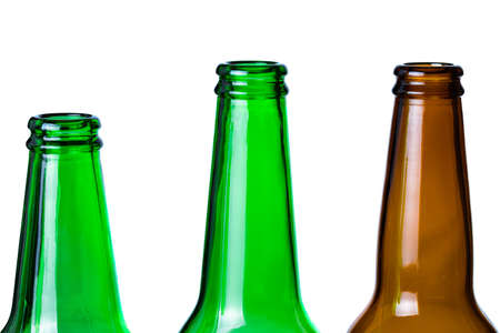 Green and brown glass bottles necks isolated on white background.の写真素材