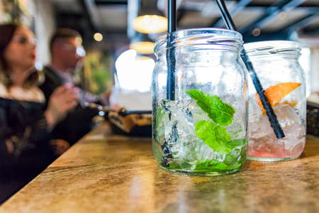 Lemonade with ice in a restaurant. Summer refreshment concept. Shallow depth of field.の写真素材